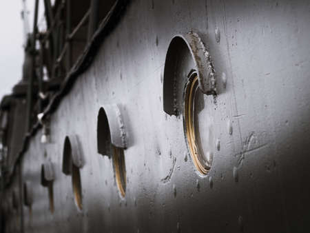 Old circle windows on the Battleshipの写真素材