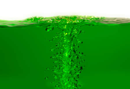 Water splash and air bubbles ,Green bubbles water isolated on white backgroundの写真素材