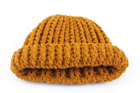 Yellow knitted wool hat isolated on white background