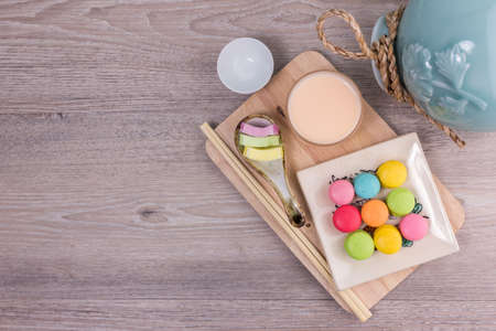 Sweet colorful macaroons on a wood backgroundの写真素材