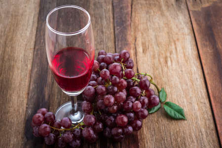 orange, grape on old wood backgoundの写真素材