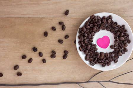 coffee beans on old wooden background