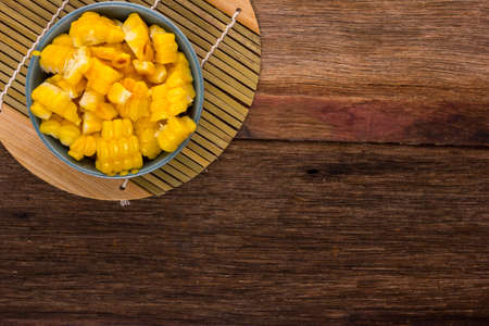 split corn on wood background, View from above with copy space.の写真素材