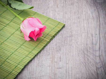 pink rose on wood background (valentine concept)の写真素材