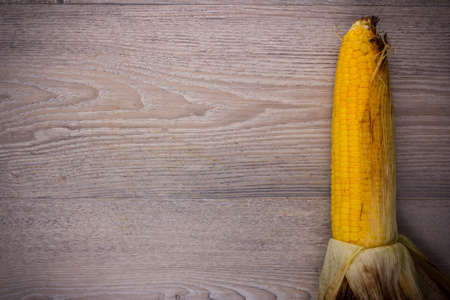 grill corn on wood background, View from above with copy space.の写真素材