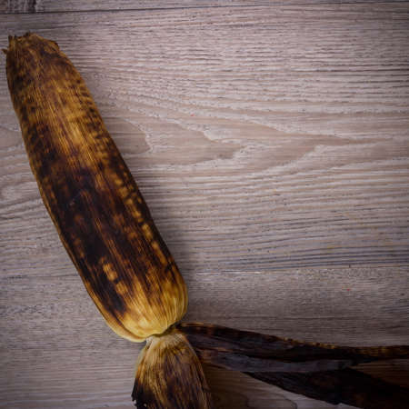 grill corn on wood background, View from above with copy space.の写真素材