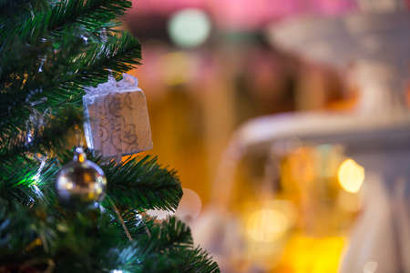 christmas tree and decorations on color bokeh backgroundの写真素材