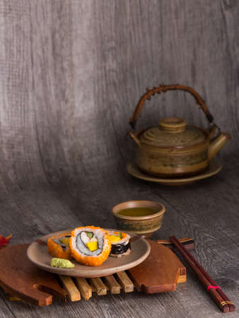 sushi  and tea drinking set on old wood backgroundの写真素材