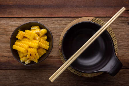 split corn on wood background, View from above with copy space.