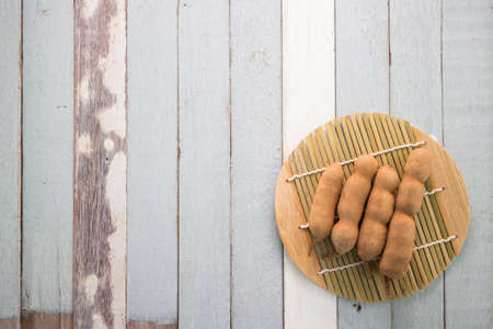 tamarind on wood tableの写真素材