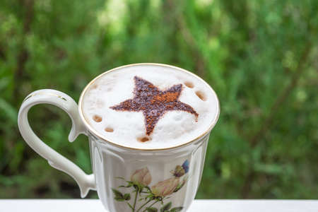 hot chocolate with green bokeh background , vintage and retro styleの写真素材