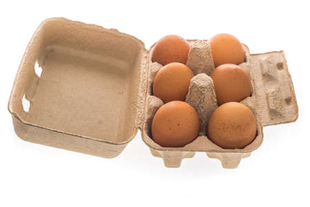 Eggs in carton on white background  ( eggs, isolated )