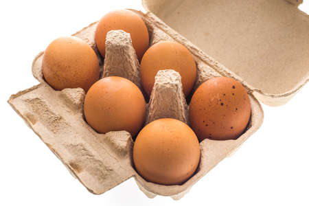 Eggs in carton on white background  ( eggs, isolated )
