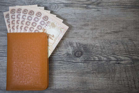 Thailand Passport and pile of Thai bath money (passport)の写真素材
