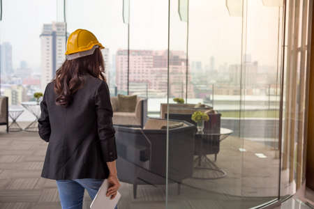 Beautiful Asia business woman over blue office background.の写真素材