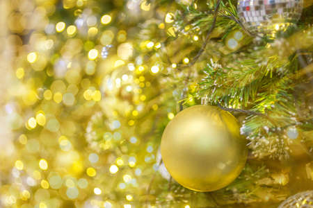 Christmas ball hanging on abstract lights backgroundの写真素材