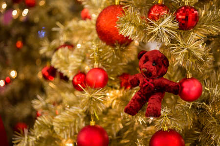 Christmas ball hanging on abstract lights backgroundの写真素材