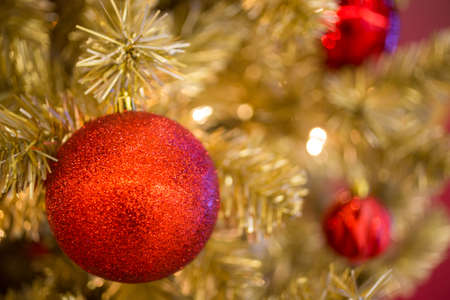 Christmas ball hanging on abstract lights backgroundの写真素材