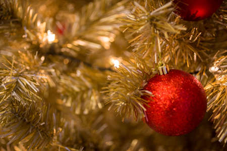 Christmas ball hanging on abstract lights backgroundの写真素材