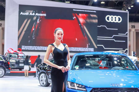 BANGKOK, THAILAND - Mar 26 : Unidentified model poses with a car at The 40th Thailand International Motor Show at IMPACT Muang Thong Thani, Bangkok, Thailand.のeditorial素材