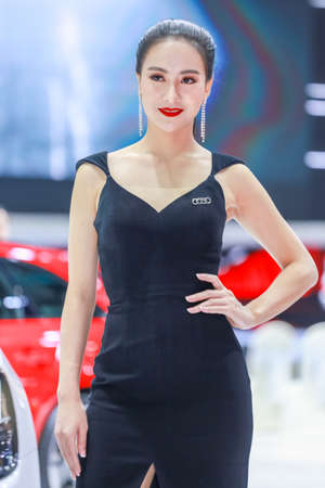 BANGKOK, THAILAND - Mar 26 : Unidentified model poses with a car at The 40th Thailand International Motor Show at IMPACT Muang Thong Thani, Bangkok, Thailand.のeditorial素材