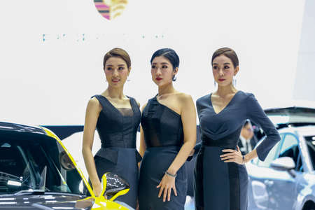 BANGKOK, THAILAND - Mar 26 : Unidentified model poses with a car at The 40th Thailand International Motor Show at IMPACT Muang Thong Thani, Bangkok, Thailand.のeditorial素材