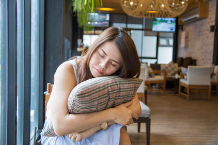 Beautiful Asia business woman over blured cafe background.の写真素材