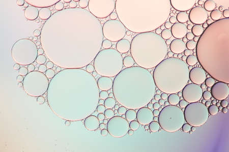 Colorful artistic of oil drop floating on the water. Pastel color bubble for background.
