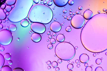 Colorful artistic of oil drop floating on the water.
