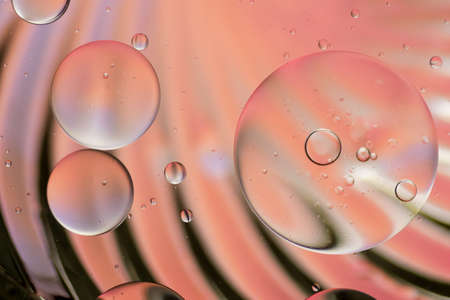 Colorful artistic of oil drop floating on the water.