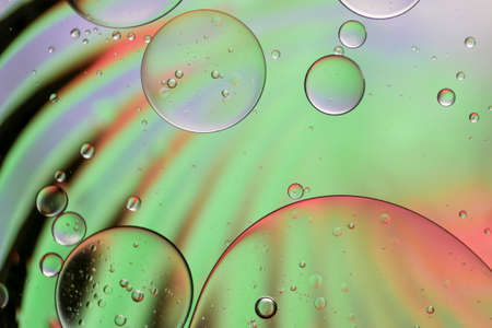 Colorful artistic of oil drop floating on the water.