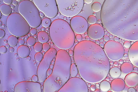 Colorful artistic of oil drop floating on the water.