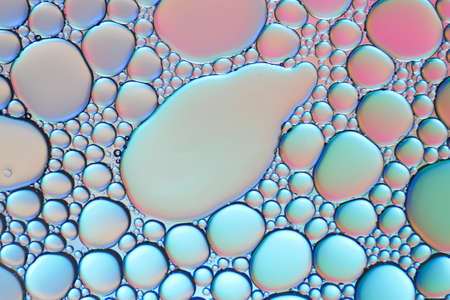 Colorful artistic of oil drop floating on the water.の写真素材