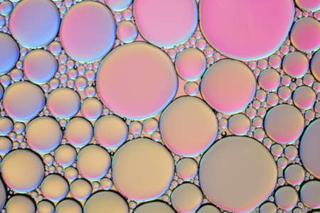 Colorful artistic of oil drop floating on the water.の写真素材