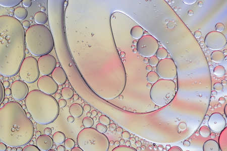 Colorful artistic of oil drop floating on the water.