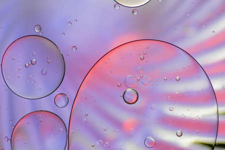 Colorful artistic of oil drop floating on the water.
