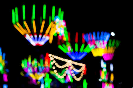 Blured Multi-colored neon lights at night.