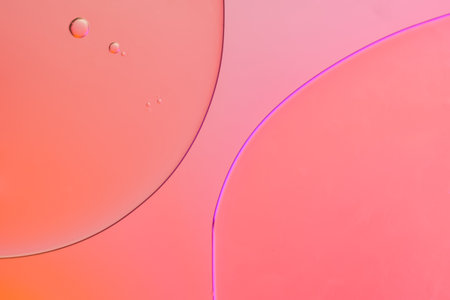 Top view movement of oil bubbles in the liquid. Oil surface multicolored background. Fantastic structure of colorful bubbles. Colorful artistic image of oil drop floating on the waterの写真素材