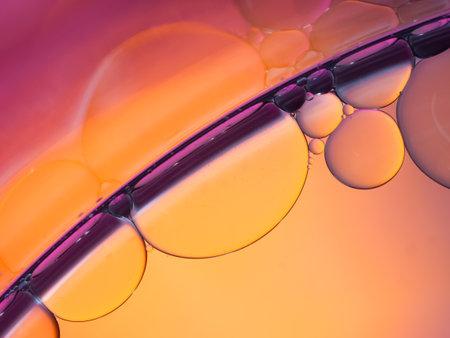 pastel artistic of oil drop floating on the water. Pastel color bubble for background. Abstract oil bubbles background. Macro shot. oil bubbles close up. Bright and unique oil drops.の写真素材