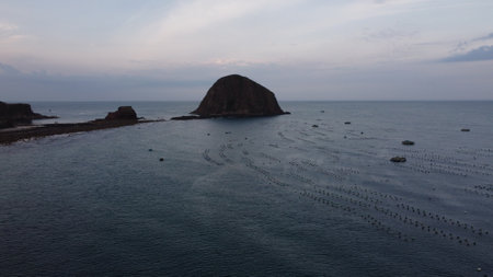 Aerial view of a rock formation in the middle of the sea