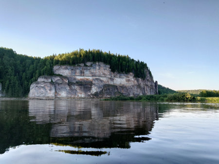 Rocky cliff on the river bank. Summer landscape.の写真素材