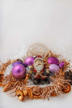 Father Christmas (Santa Claus) with a snowman in the tinsel. among Christmas balls and Christmas decoration.の写真素材