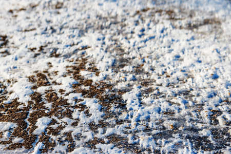 Snowy winter city road with tire trace.の写真素材