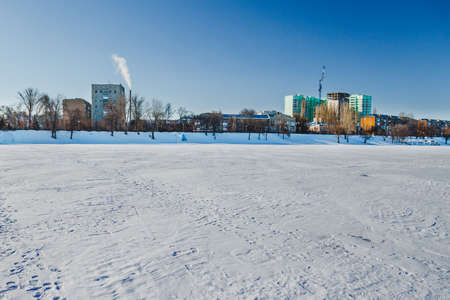 Winter landscape on a frozen river Volga in center of the cityの写真素材