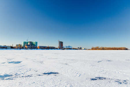 Winter landscape on a frozen riverの写真素材