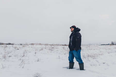 traveler walking in a winter steppeの写真素材