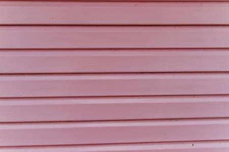 Wooden material background painted with pink paint for Wallpaperの写真素材