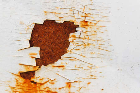 Corroded white metal background. Rusted white painted metal wall. Rusty metal background with streaks of rust. Rust stains. The metal surface rusted spots. Rysty corrosion.の写真素材