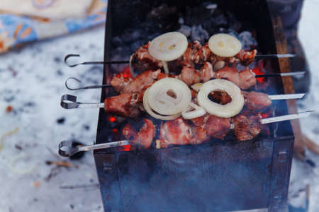 Juicy slices of meat with sauce prepare on fire. shish kebab.の写真素材