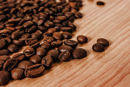the coffee beans on old tableの写真素材